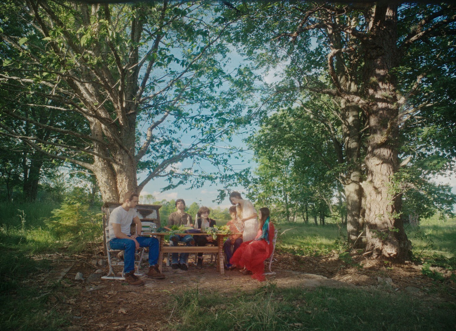 A Wonderful Way with Dragons — still (ensemble under trees)